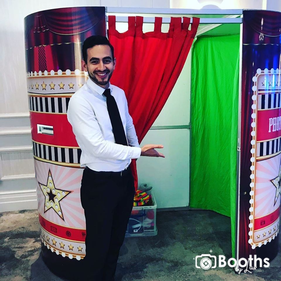 An operator welcoming guests into a Photo Booth.